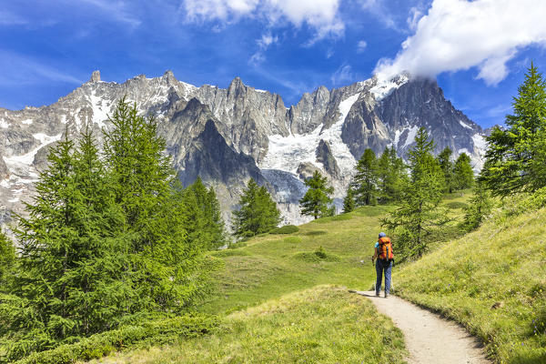 A trekker is walking to the Bonatti Refuge during the Mont Blanc hiking tours (Ferret Valley, Courmayeur, Aosta province, Aosta Valley, Italy, Europe) (MR)
