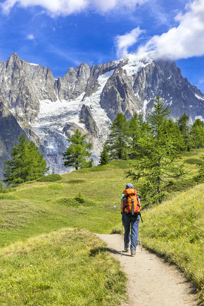 A trekker is walking to the Bonatti Refuge during the Mont Blanc hiking tours (Ferret Valley, Courmayeur, Aosta province, Aosta Valley, Italy, Europe) (MR)
