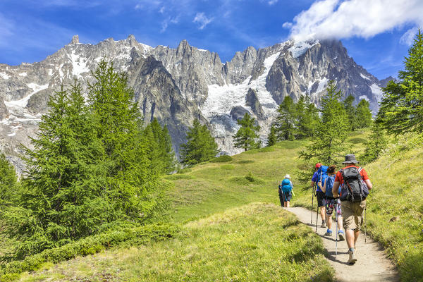 A group of trekkers are walking to the Bonatti Refuge during the Mont Blanc hiking tours (Ferret Valley, Courmayeur, Aosta province, Aosta Valley, Italy, Europe)
