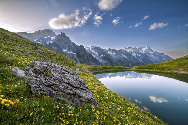 The Mont Blanc Massif reflected in the Checrouit Lake at sunset during the Mont Blanc hiking tours (Veny Valley, Courmayeur, Aosta province, Aosta Valley, Italy, Europe)
