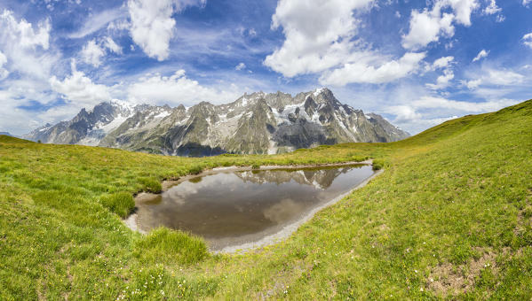 A panoramic view of the Mont Blanc Massif, from the summit of the Mont Blanc to the Grandes Jorasses (Mont de la Saxe, Ferret Valley, Courmayeur, Aosta province, Aosta Valley, Italy, Europe)
