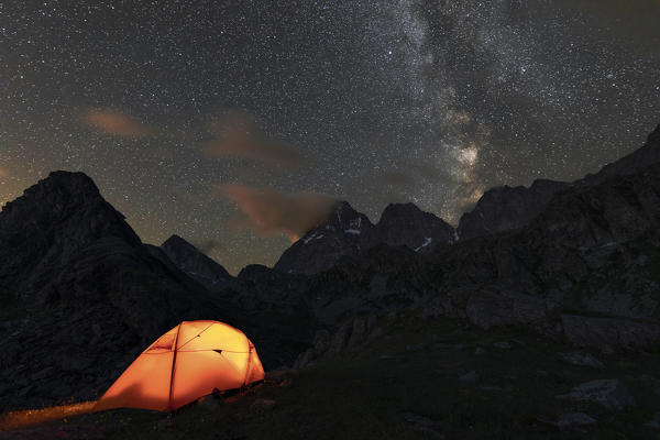 The Monviso Peak and the Milky Way in a summer night from the Fiorenza Lake (Pian del Re, Monviso Natural Park, Po Valley, Crissolo, Cuneo province, Piedmont, Italy, Europe)