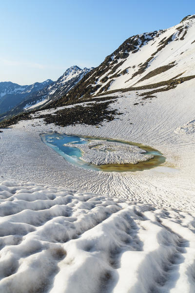 A small thaw lake under Sforzellina Peak. La valleta, Pejo valley, Trentino, Italy.