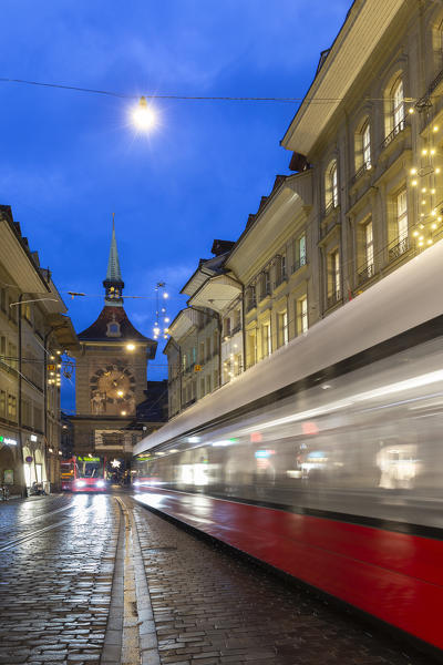 Transit of tram at Zytglogge tower at dusk. Bern, Canton of Bern, Switzerland, Europe.