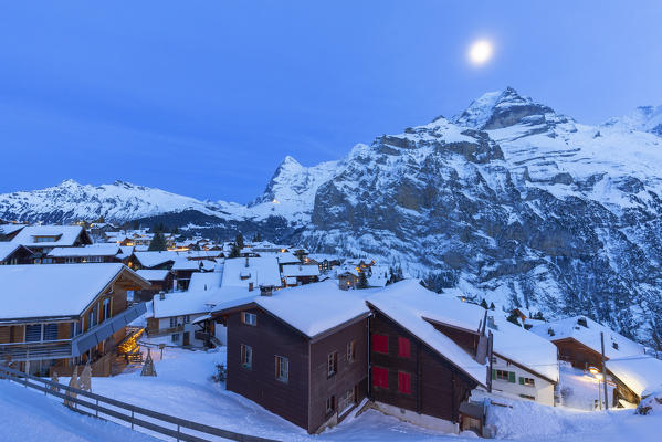 Winter twilight in Murren, Lauterbrunnen valley, Canton of Bern, Switzerland, Europe.