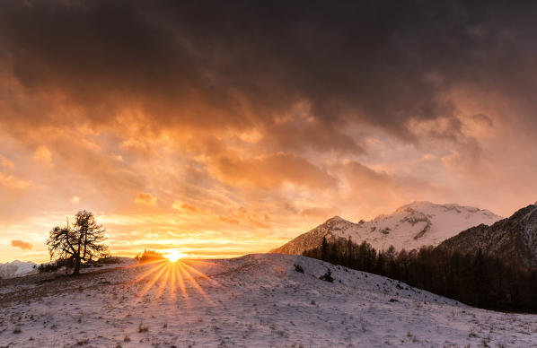 Winter red sunset. Valmasino, Valtellina, Lombardy, Italy, Europe.