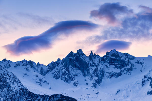 Colourful clouds above Sciore peaks, Bregaglia Valley, Canton of Grisons, Switzerland, Europe.