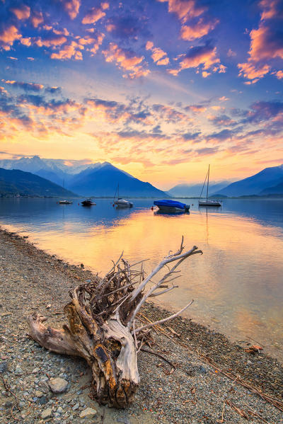 Colourful sunset with moored boats. Como Lake, Lombardy, Italy, Europe.