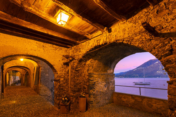 Sunrise from a covered Walk of Lovers(Passeggiata degli innamorati) in Varenna. Como Lake, Lombardy, Italy, Europe.