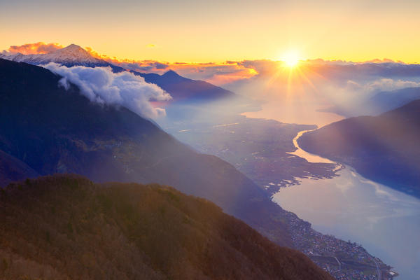 Sunset light with view on Como Lake and Mezzola Lake. Valchiavenna, Valtellina, Lombardy, Italy, Europe.