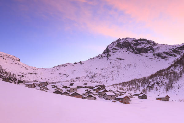 Sunset at Alpe Lendine in winter. Vallespluga, Valchiavenna, Valtellina, Lombardy, Italy, Europe.