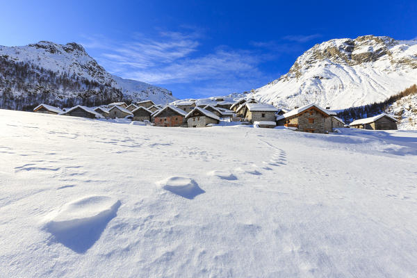 Footprints in the snow at Alpe Lendine. Vallespluga, Valchiavenna, Valtellina, Lombardy, Italy, Europe.