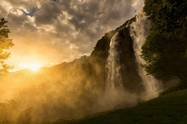 Sunset at Acquafraggia Waterfall in spring. Valchiavenna, Valtellina, Lombardy, Italy, Europe.