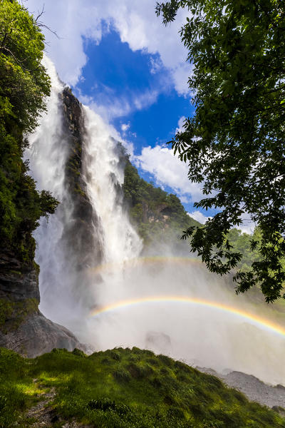 Acquafraggia Waterfall in spring with a rainbow. Valchiavenna, Valtellina, Lombardy, Italy, Europe.