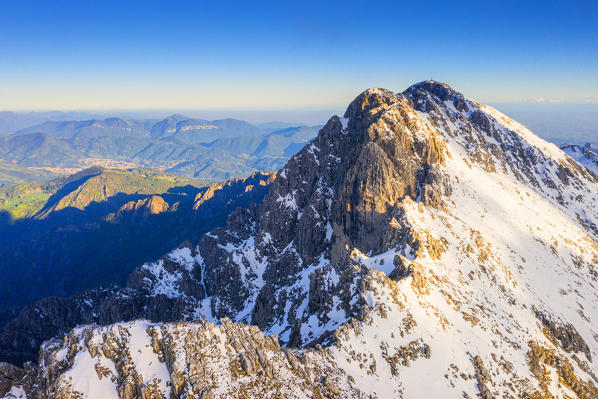 Monte Alben illumineted by sun at sunset. Val Seriana, Orobie, Lombardy, Italy, Europe.