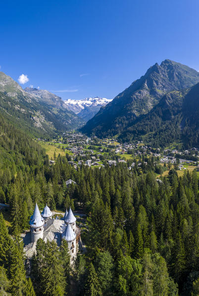 Aerial view of Castel Savoia with Gressoney and Monte Rosa in the background. Valle d'Aosta, Italy, Europe.