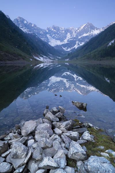 Pizzo del Diavolo is reflected in the Lago Zappello at dusk. Ambria valley, Orobie Alps, Valtellina, Sondrio province, Lombardy, Italy, Europe.