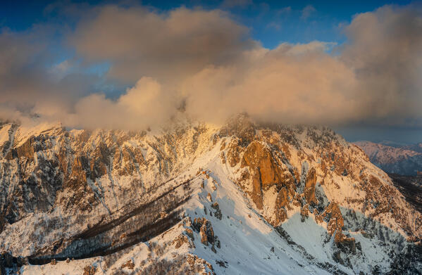 Aerial view of rock pinnacles of Grignetta at sunset with Rifugio Rosalba. Grignetta, Grigne group, Lake Como, Lombardy, Italy, Europe