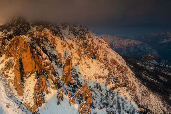 Aerial view of rock pinnacles of Grignetta at sunset. In the centre of the image Torre Cecilia. Grigne group, Lake Como, Lombardy, Italy, Europe