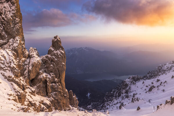 Torrione del Cinquantenario at sunset after a snowfall with view on Como Lake. Grignetta, Grigne group, Lake Como, Lombardy, Italy, Europe