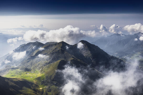 Cima di Grem between clouds. Prealpi Orobie. Serina valley,  Lombardy, Italy, Europe.