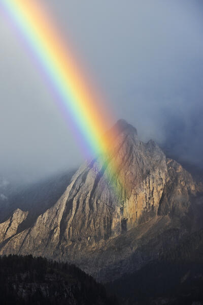 Rainbow on Gran Vernel during a summer sunset. Val di Fassa(Fassa valley, Dolomites, Trentino Alto Adige, Italy, Europe