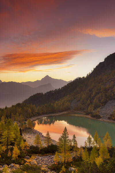 Autumnal sunrise at Lake Lagazzuolo. Valmalenco, Valtellina, Lombardy, Italy, Europe.