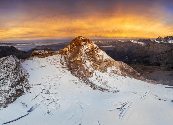 Aerial view of Pizzo Scalino at sunrise with view on the glacier. Valmalenco, Valtellina, Lombardy, Italy, Europe.