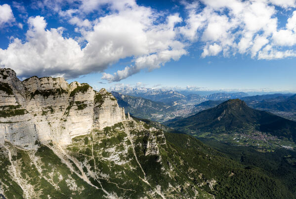 Aerial view of mountain group of Vigolana with view on the city of Trento and Adige Valley. Altopiano della Vigolana, Trento province, Trentino Alto Adige, Italy, Europe.