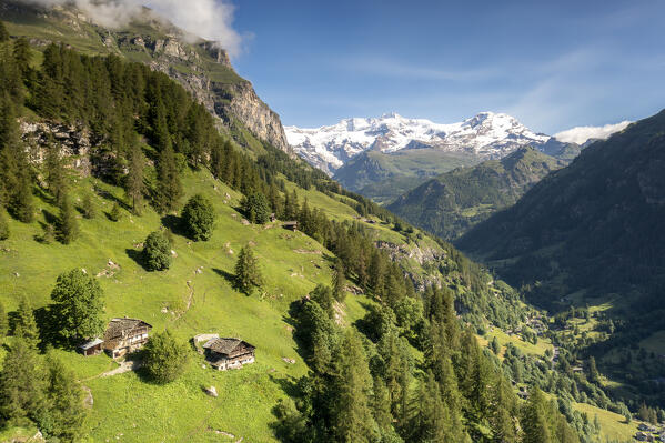 Aerial view of traditional walser  houses with view on Monte Rosa group. Gressoney, Lys valley(Valle del Lys), Aosta province, Aosta valley, Italy, Europe.