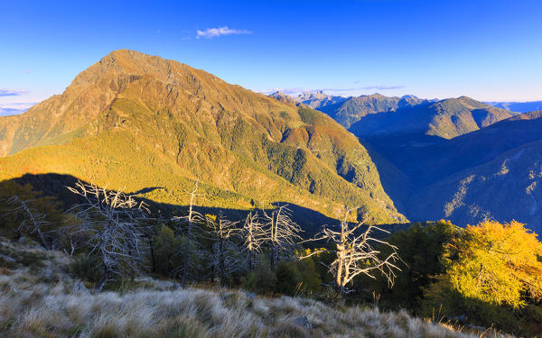 Autumnal view of Mount Legnone from Legnoncino, Varrone Valley, Lombardy, Italy.