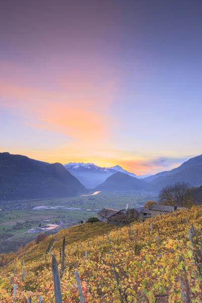 Sunset from a small group of houses in the wineyards of Berbenno, Valtellina, Sondrio province, Lombardy, Italy.