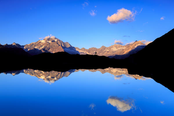 Mount Disgrazia reflected in the water, Valmalenco, Valtellina,Sondrio province, Lombardy, Italy.