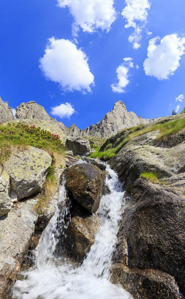 A waterfall at the foot of Luigi Amedeo Peak, Valmasino, Valtellina, Sondrio province, Lombardy, Italy.