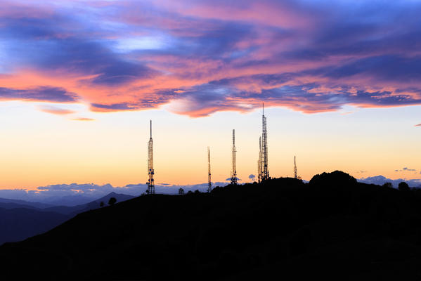 Television antennas during stunning sunset.  Valico di Valcava(Valcava Pass), Val San Martino, Prealpi Bergamasche, Bergamo province, Lombardy, Italy.