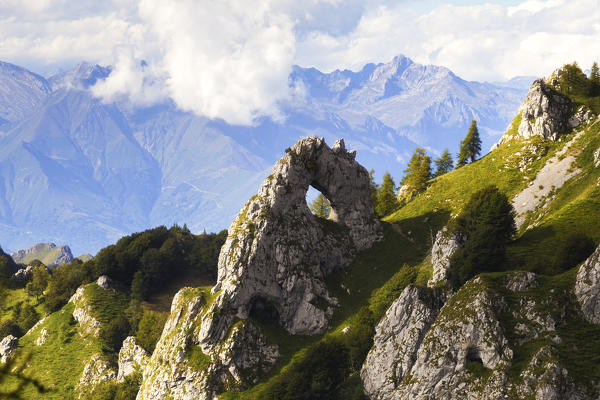 The Porta di Prada,  a rock natural arch in the Grigna group. Grigna Settentrionale(Grignone), Northern Grigna Regional Park, Lombardy, Italy, Europe.