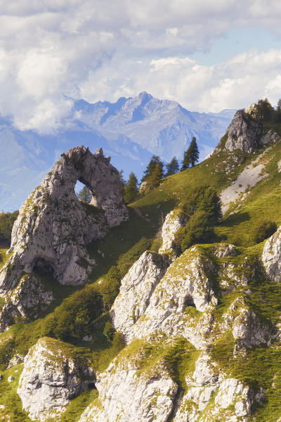 The Porta di Prada,  a rock natural arch in the Grigna group. Grigna Settentrionale(Grignone), Northern Grigna Regional Park, Lombardy, Italy, Europe.