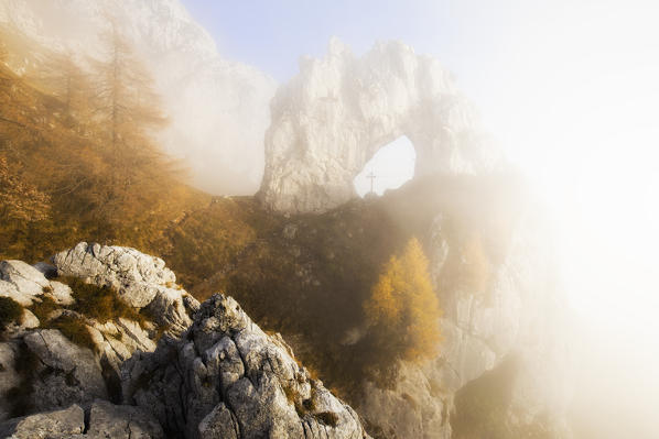 Porta di Prada hidden by fog during autumn. Bocchetta di Prada, Grigna Settentrionale(Grignone), Northern Grigna Regional Park, Lombardy, Italy, Europe.