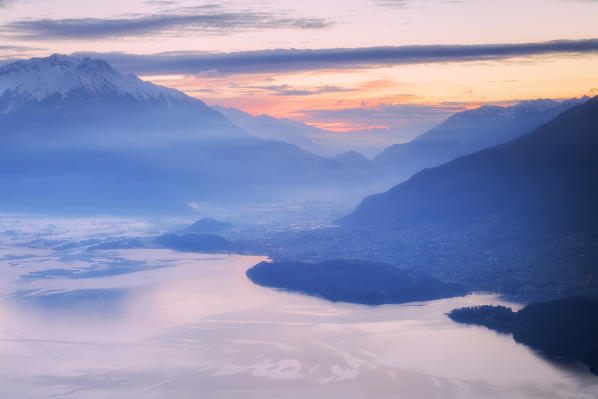 Sunrise on Como Lake and Valtellina from above. San Bernardo Church, Monte Bregagno, Dongo, Como Lake, Lombardy, Italy, Europe.