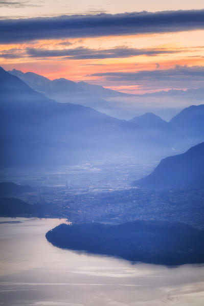 Sunrise on Como Lake and Valtellina from above. San Bernardo Church, Monte Bregagno, Dongo, Como Lake, Lombardy, Italy, Europe.