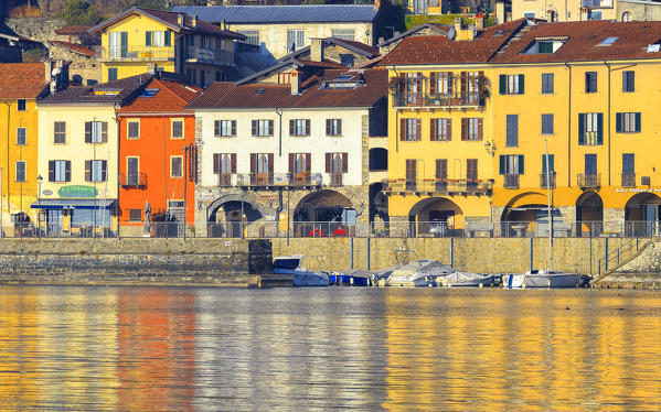 Colored houses of Domaso are mirrored in the lake. Domaso, Como Lake, Lombardy, Italy, Europe.