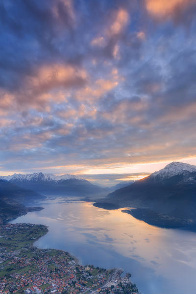 Stunning sunrise over the village of Dongo and Como Lake, from above. San Bernardo Church, Monte Bregagno, Dongo, Como Lake, Lombardy, Italy, Europe.