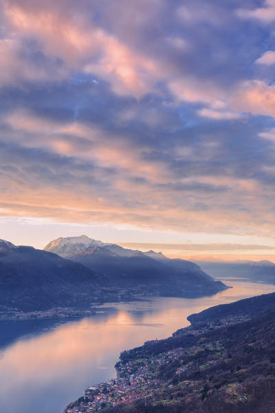 Stunning sunrise over Como Lake. San Bernardo Church, Monte Bregagno, Dongo, Como Lake, Lombardy, Italy, Europe.