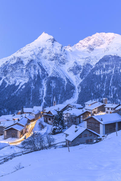 Dusk at the village of Latsch with Piz Ela in the background. Bergun, Albula Valley, District of Prattigau/Davos, Canton of Graubünden, Switzerland, Europe.