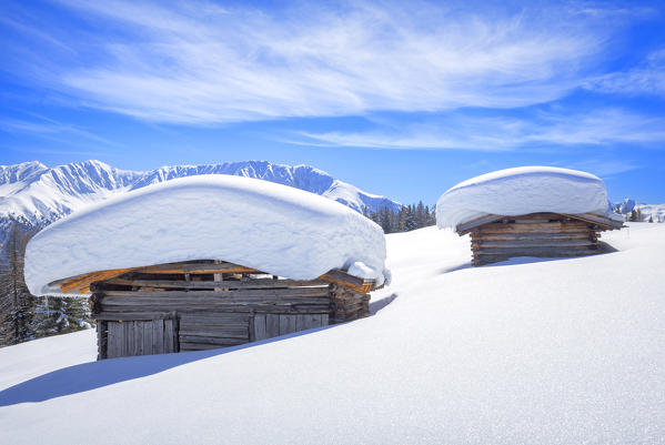 Typical alpine huts after a heavy snowfall. Wiesner Alp, Davos Wiesen, Landwasser Valley, Albula Valley, District of Prattigau/Davos, Canton of Graubünden, Switzerland, Europe.