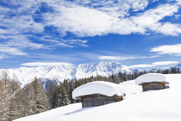 Typical alpine huts after a heavy snowfall. Wiesner Alp, Davos Wiesen, Landwasser Valley, Albula Valley, District of Prattigau/Davos, Canton of Graubünden, Switzerland, Europe.