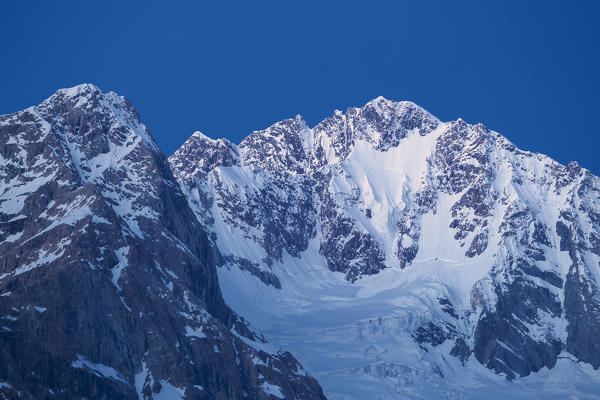 Mount Disgrazia at dusk. Chiareggio Valley, Valmalenco, Valtellina, Lombardy, Italy, Europe