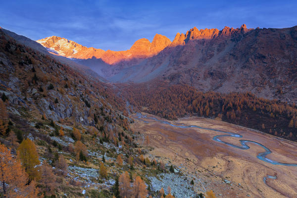 Elevated view of the Piana di Predarossa during sunset. Predarossa Valley, Valmasino, Valtellina, Lombardy, Italy, Europe.