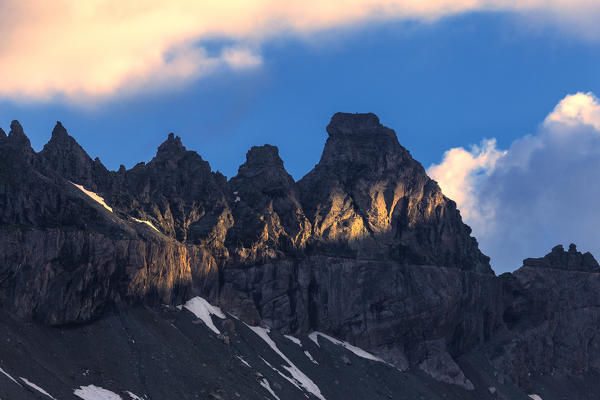 Ray of sunshine hits the Tschingelhorner. Unterer Segnesboden, Flims, District of Imboden, Canton of Grisons, Switzerland, Europe