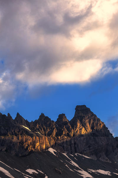 Ray of sunshine hits the Tschingelhorner. Unterer Segnesboden, Flims, District of Imboden, Canton of Grisons, Switzerland, Europe